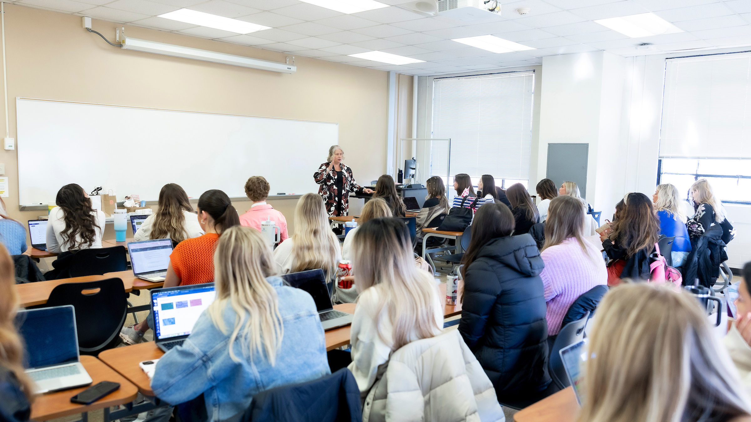 Students learn in the 2024 Color Me Spring Fashion Show Planning Class with Dr. Scarlett Wesley.