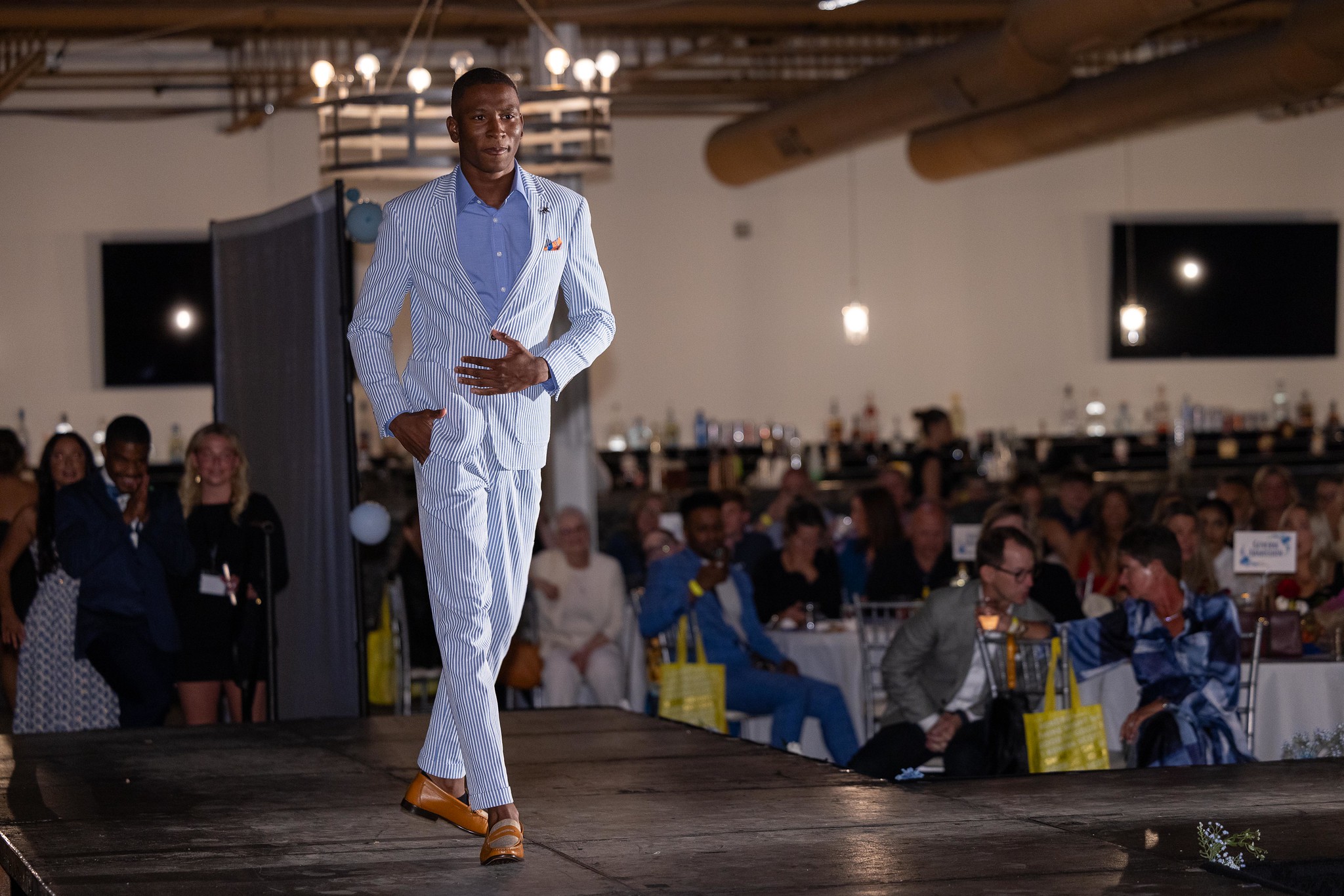 A male model walks the runway at the 2025 Color Me Kentucky spring show